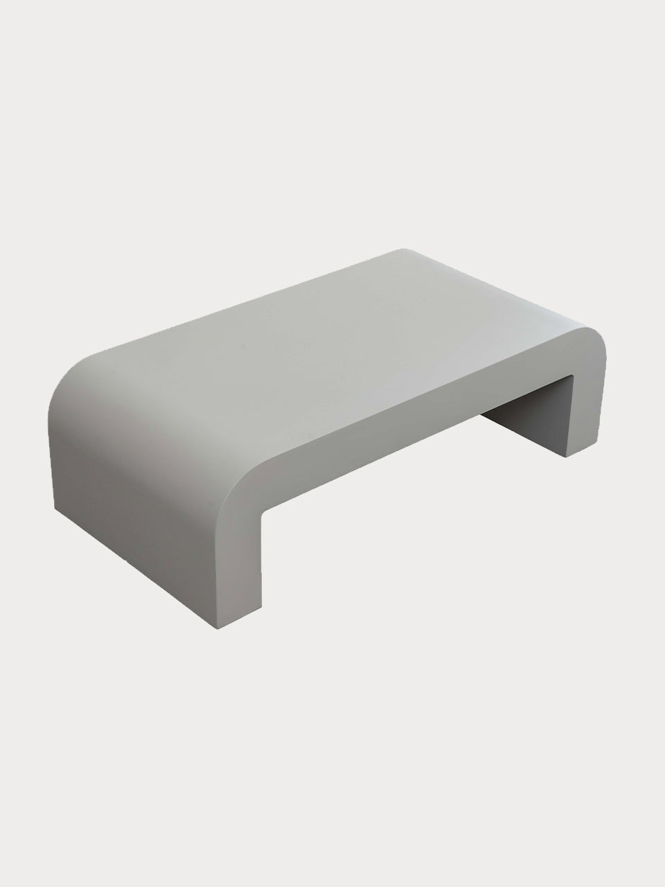 Mesa de centro minimalista en acabado blanco roto en vista lateral cenital.