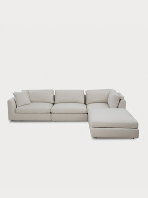 Sofá modular minimalista en tejido beige en vista frontal.